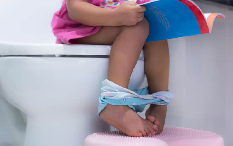 child waited until bedtime to poop, on potty