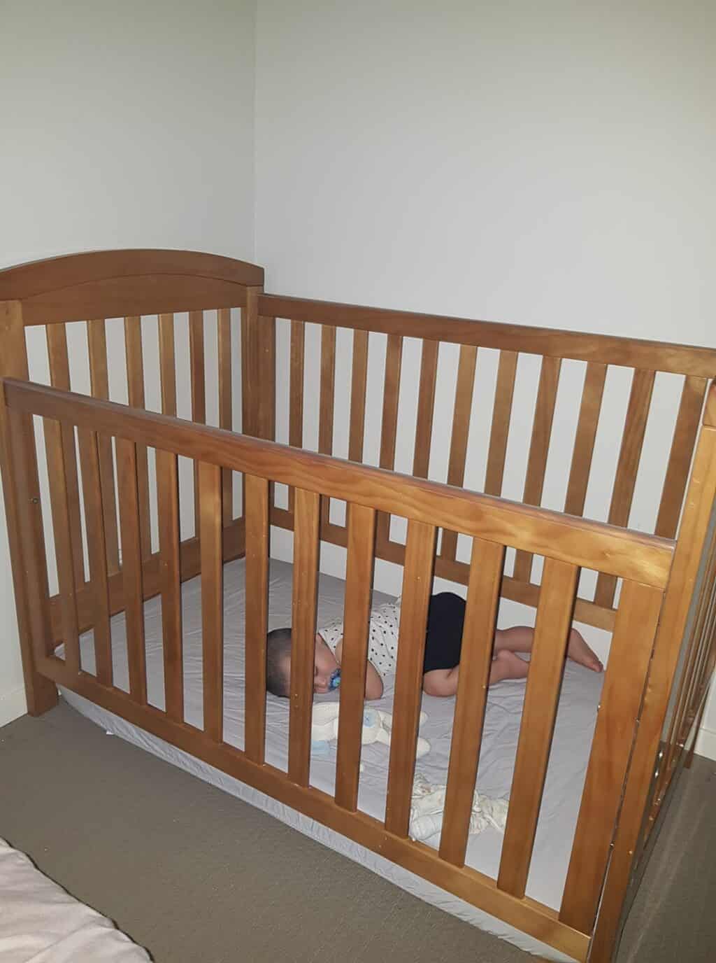 crib mattress lowered so baby can't climb out and over